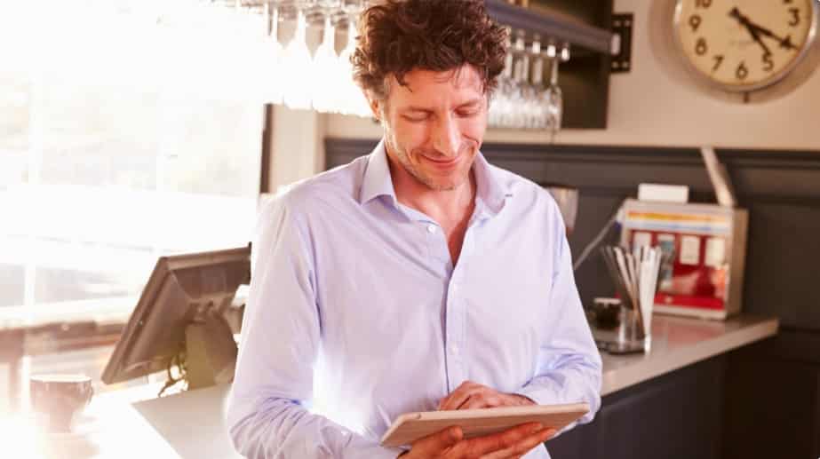 restaurant owner using tablet